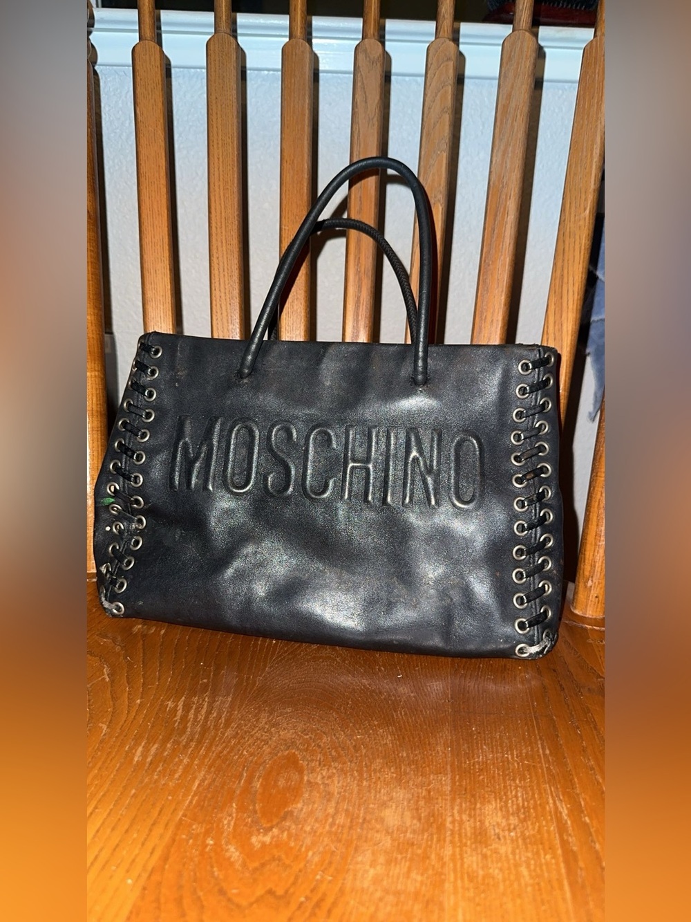 Authentic Designer Moschino Black Embossed Logo Lace-Up Leather Tote.